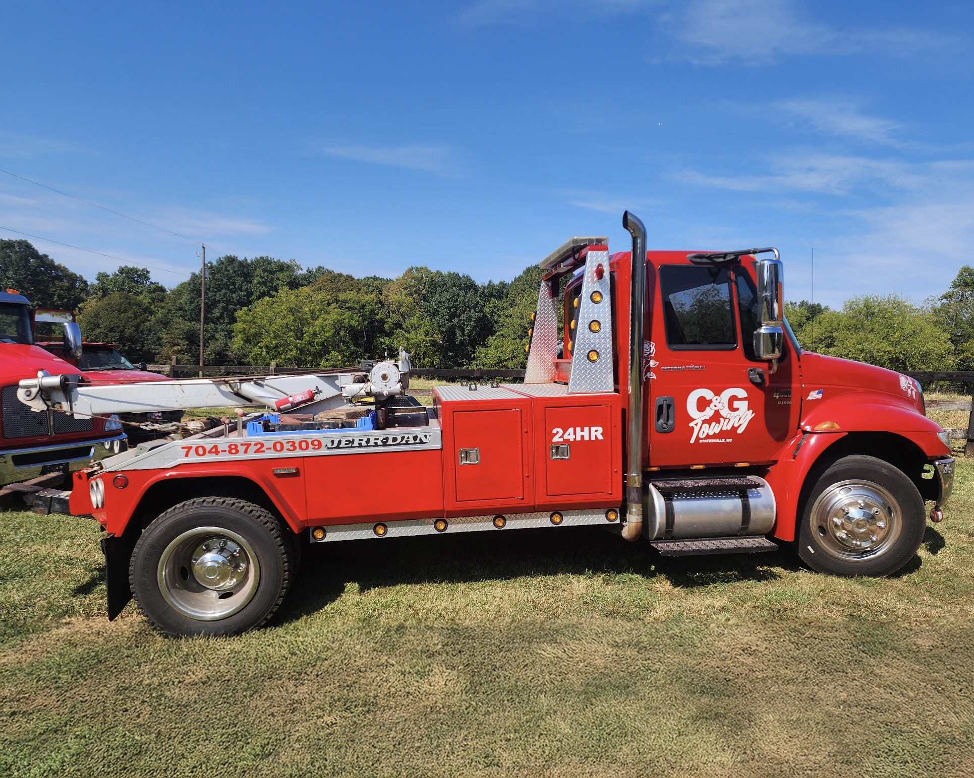 C and G Towing red wrecker truck in daylight